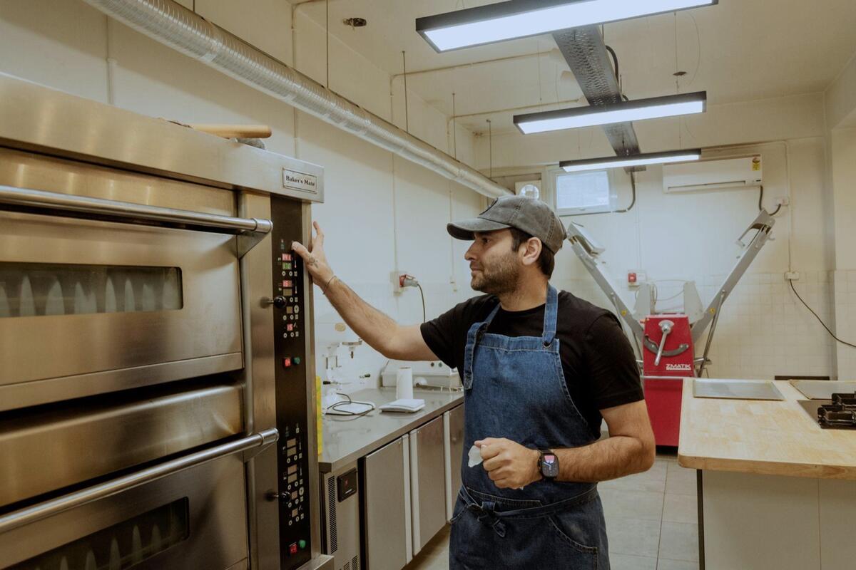 Saqib at the deck oven
